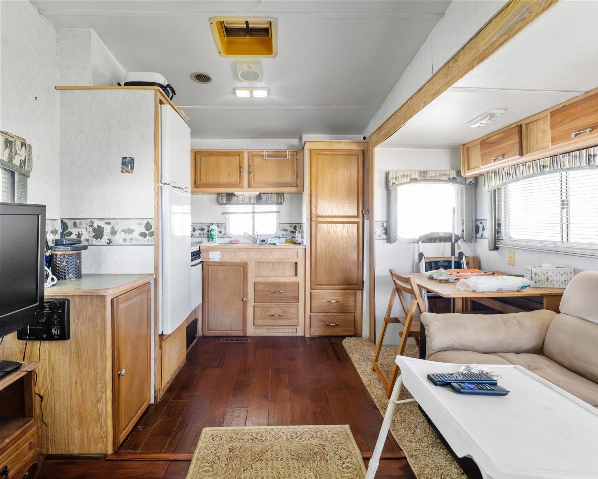 14507 Chimaera Road Sargent, TX 77414 - Photo 15 of 27 a kitchen with stainless steel appliances a stove a sink a refrigerator and cabinets