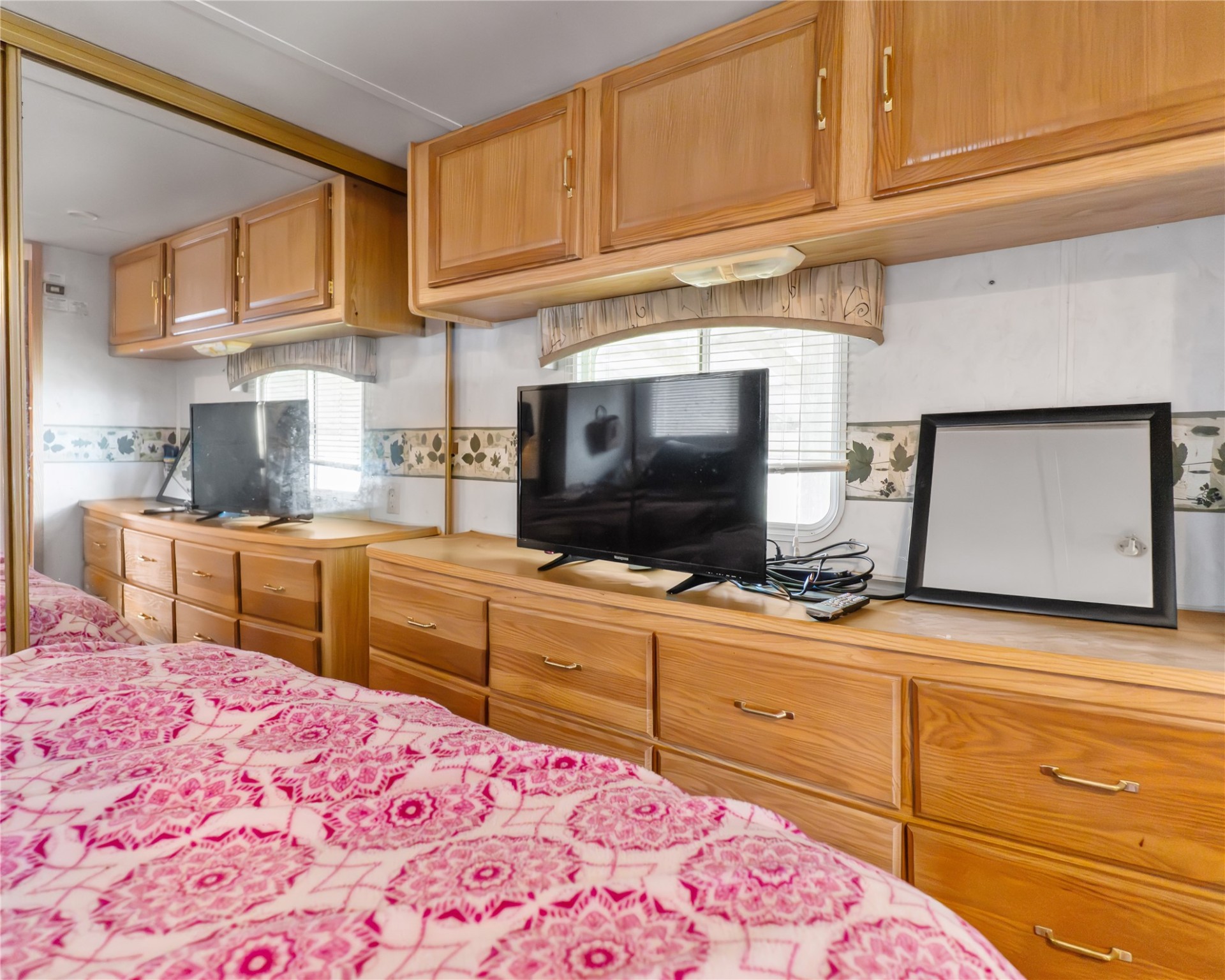 14507 Chimaera Road Sargent, TX 77414 - Photo 19 of 27 a kitchen with stainless steel appliances kitchen island granite countertop a sink and cabinets