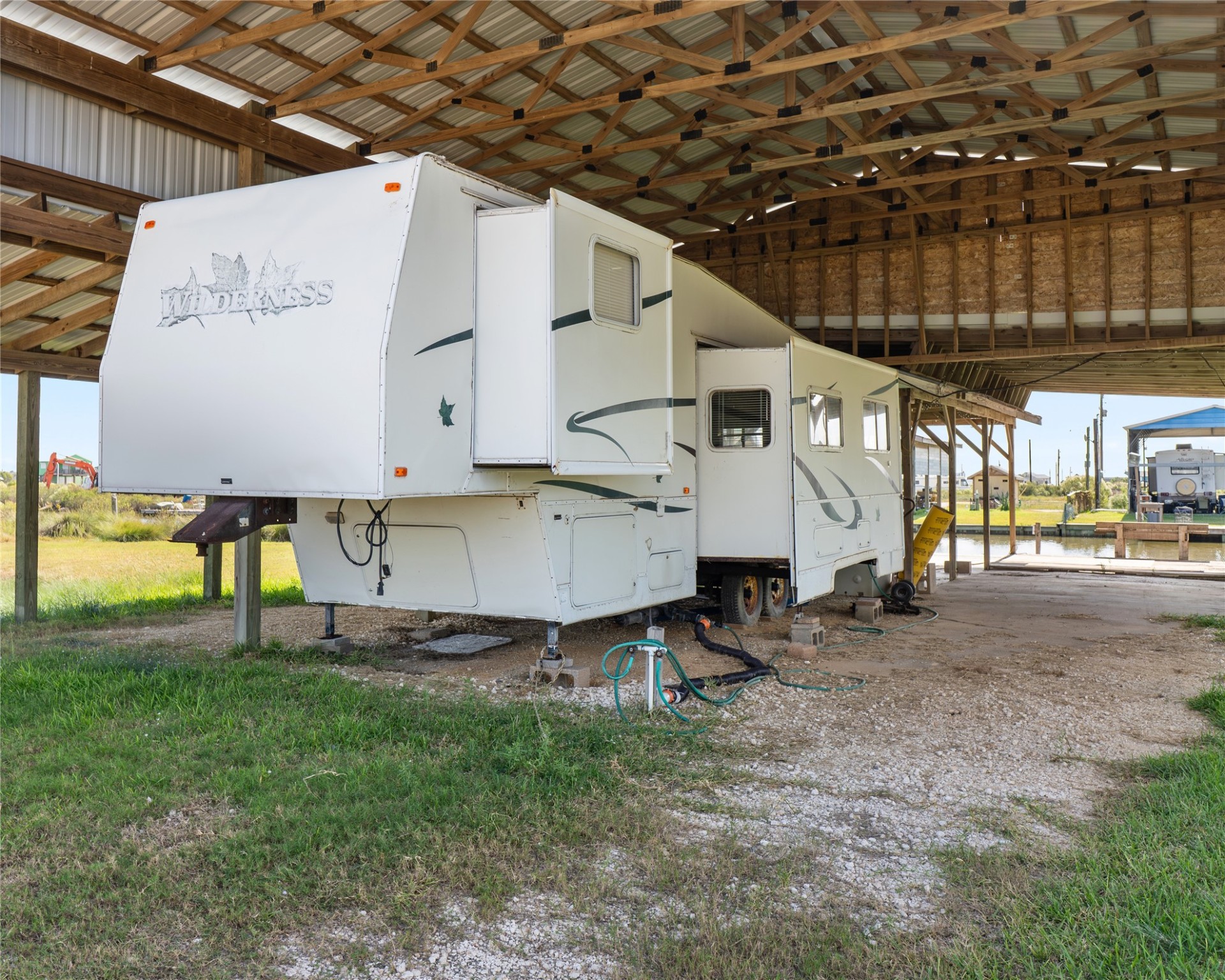 14507 Chimaera Road Sargent, TX 77414 - Photo 26 of 27 a view of a back yard of the house