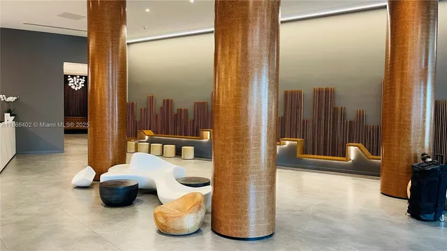 a view of a living room and a balcony