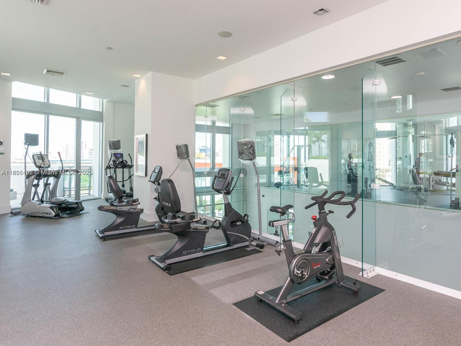 350 South Miami Avenue, Unit 2611 Miami, FL 33130 - Photo 23 of 34 a view of a room with gym equipment