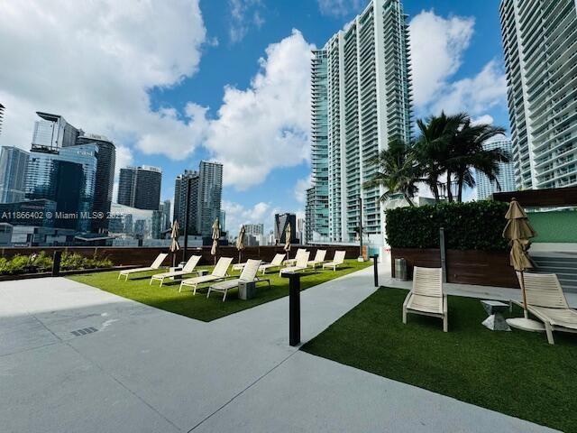 350 South Miami Avenue, Unit 2611 Miami, FL 33130 - Photo 29 of 34 a view of a swimming pool and lounge chairs