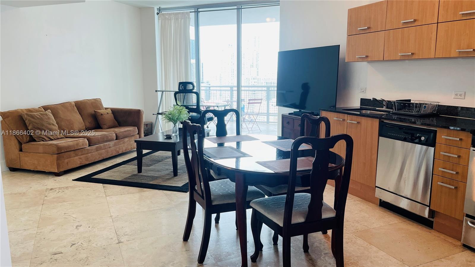 350 South Miami Avenue, Unit 2611 Miami, FL 33130 - Photo 7 of 34 a view of a dining room with furniture window and outside view