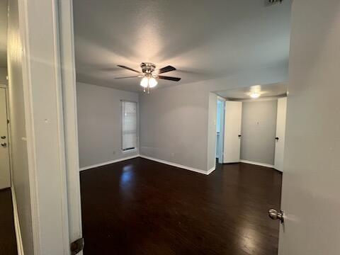 817 West Rochelle Road Irving, TX 75062 - Photo 9 of 21 an empty room with wooden floor and fan
