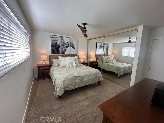 a bedroom with bed and window