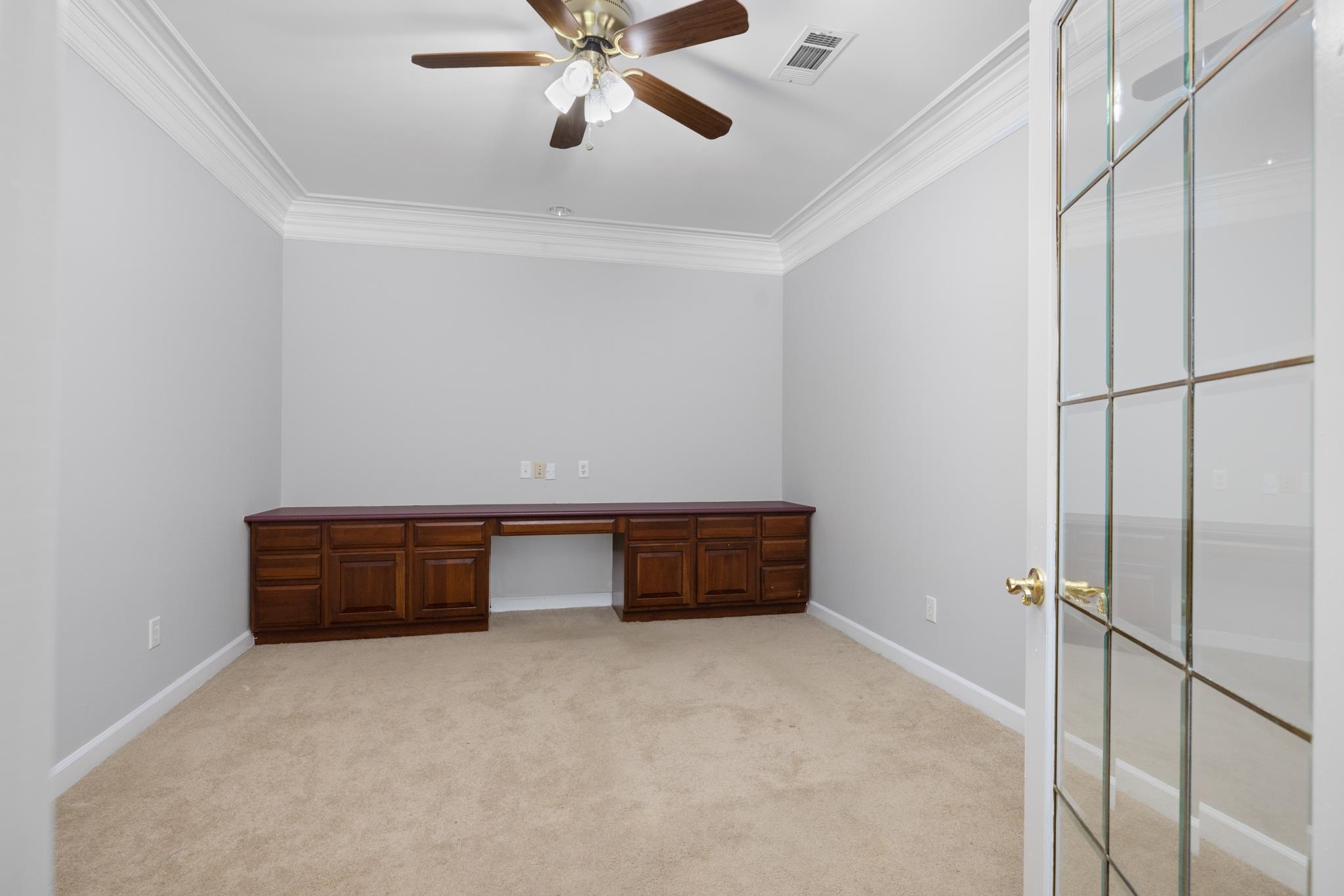 4839 Mayfield Road West Collierville, TN 38017 - Photo 25 of 40 Unfurnished office with built in study area, ornamental molding, light carpet, and a ceiling fan