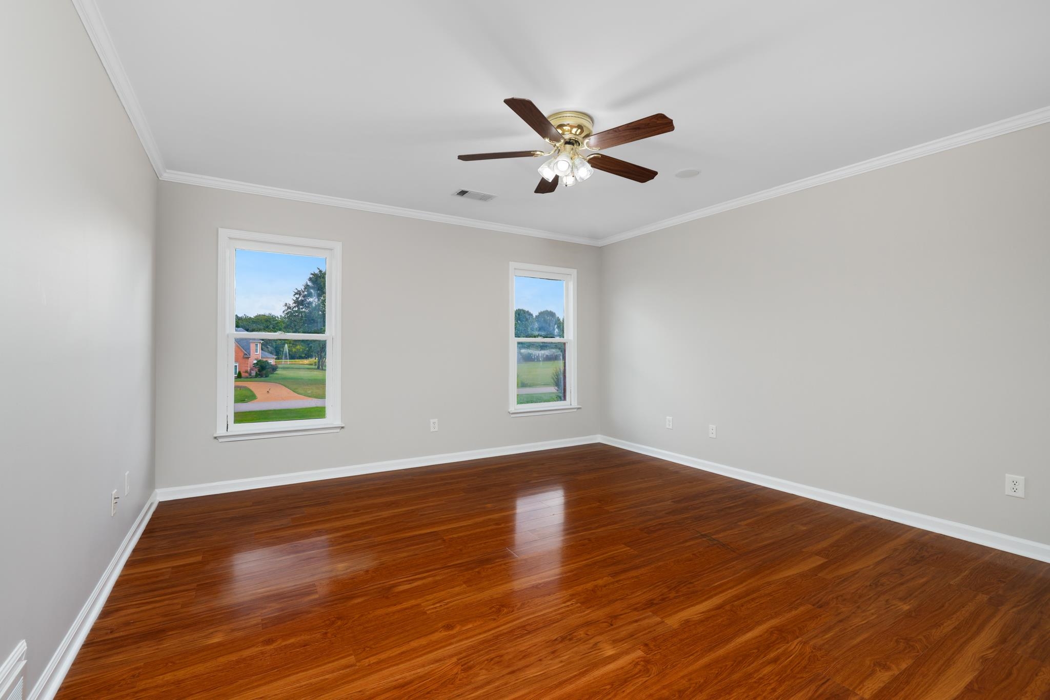 4839 Mayfield Road West Collierville, TN 38017 - Photo 37 of 40 Spare room featuring ornamental molding, dark wood finished floors, and a ceiling fan