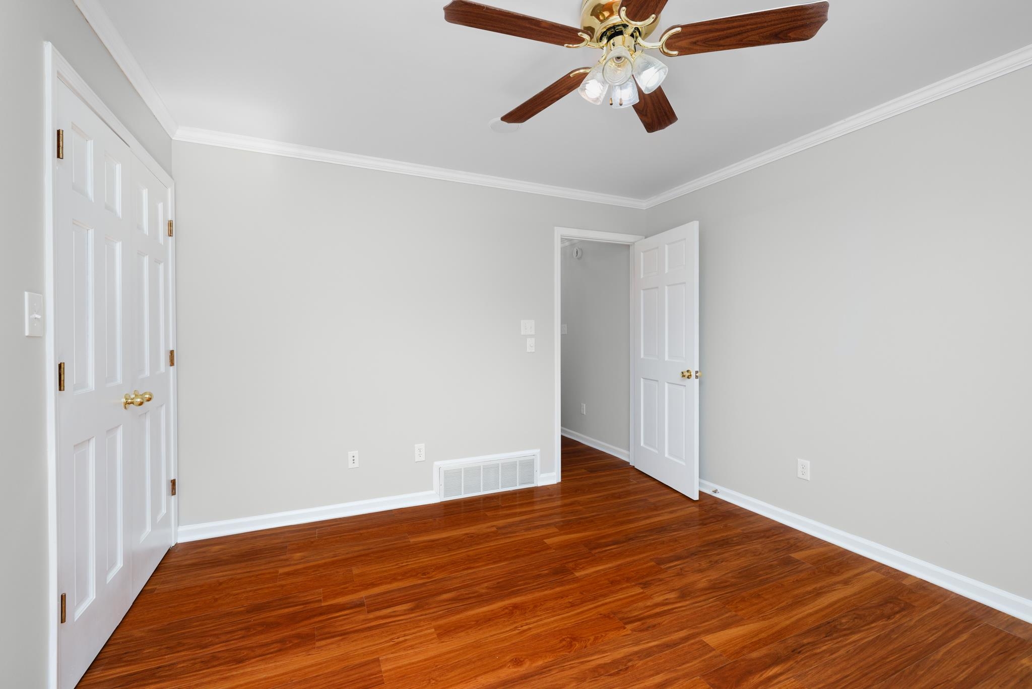 4839 Mayfield Road West Collierville, TN 38017 - Photo 4 of 40 Unfurnished room with dark wood finished floors, crown molding, and ceiling fan