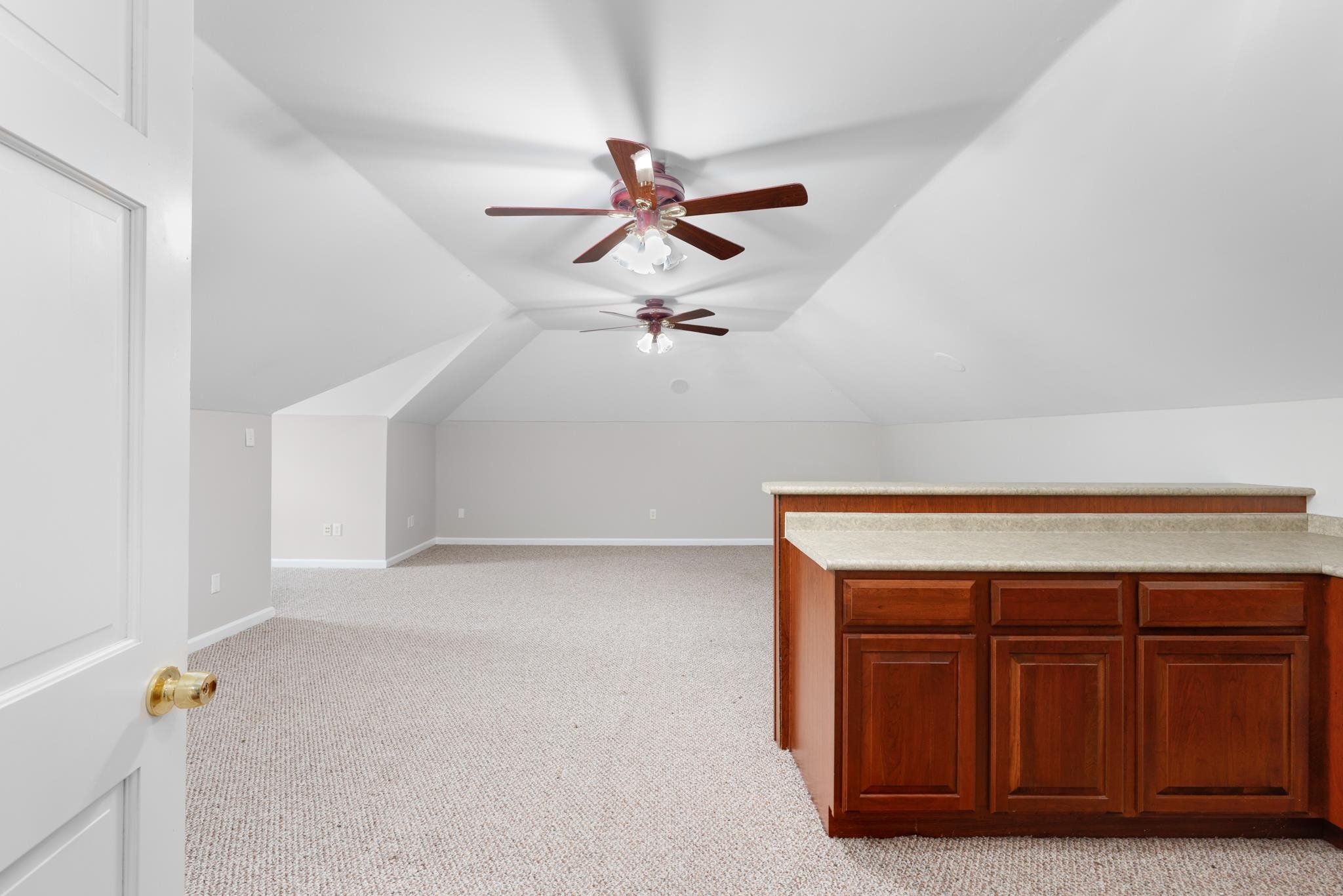 4839 Mayfield Road West Collierville, TN 38017 - Photo 7 of 40 Bonus room with light carpet, a ceiling fan, and vaulted ceiling