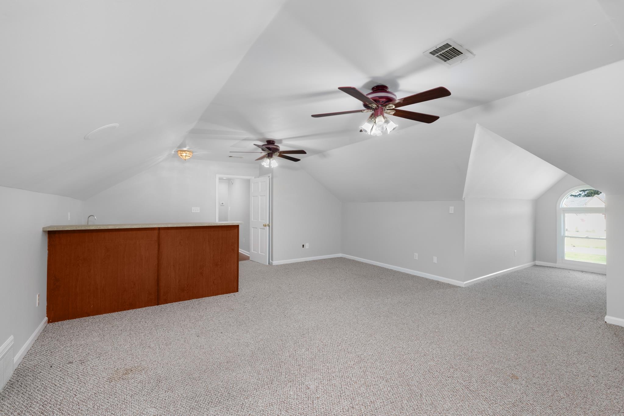 4839 Mayfield Road West Collierville, TN 38017 - Photo 8 of 40 Bonus room featuring vaulted ceiling, light carpet, and a ceiling fan