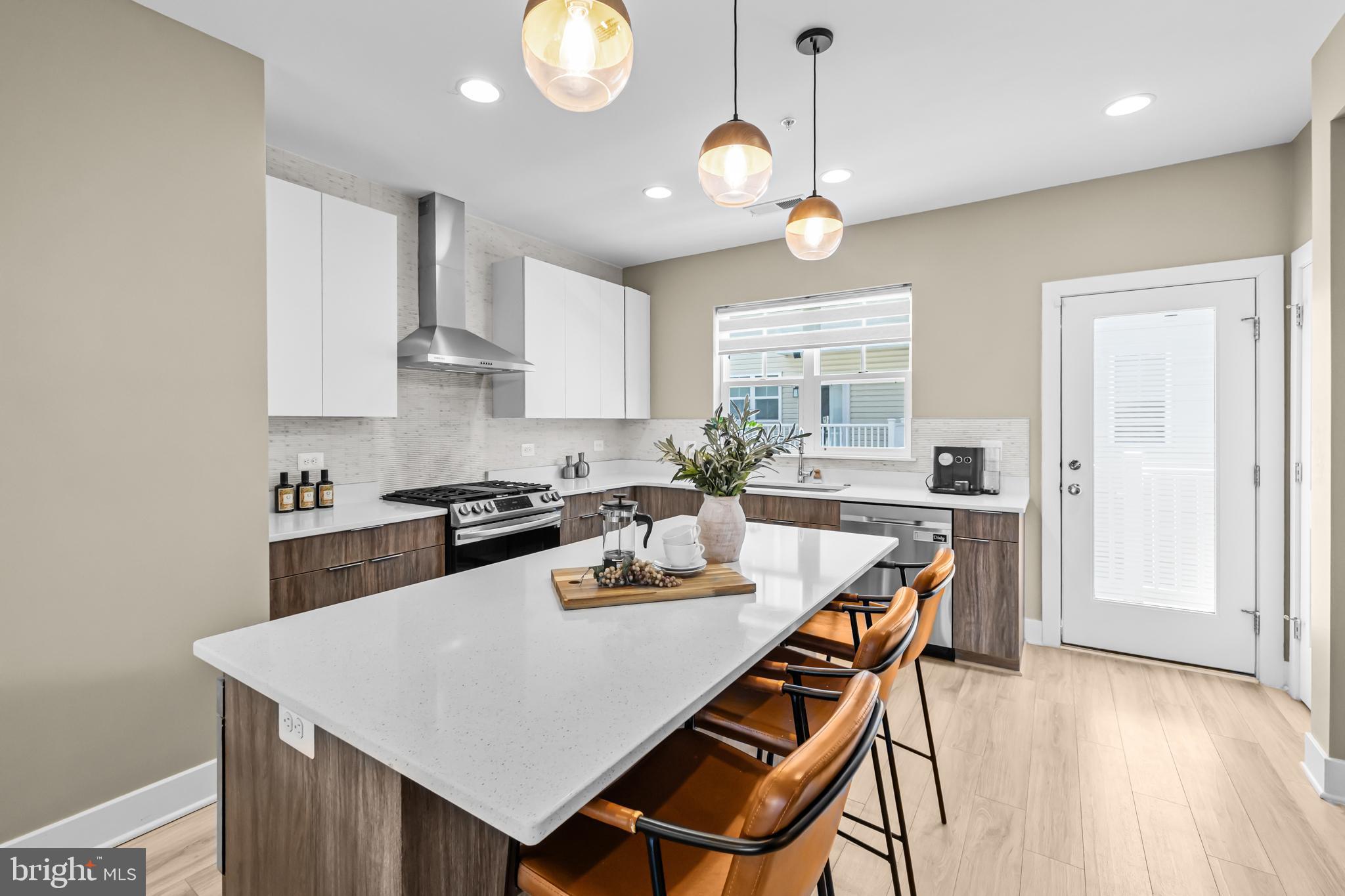 4509 12th Street Northeast Washington, DC 20017 - Photo 11 of 45 a kitchen with a dining table and chairs