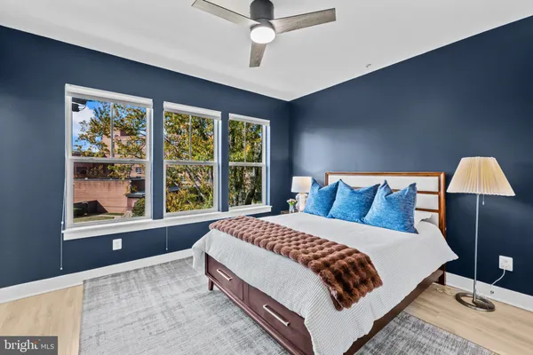 a bedroom with a large bed and a window