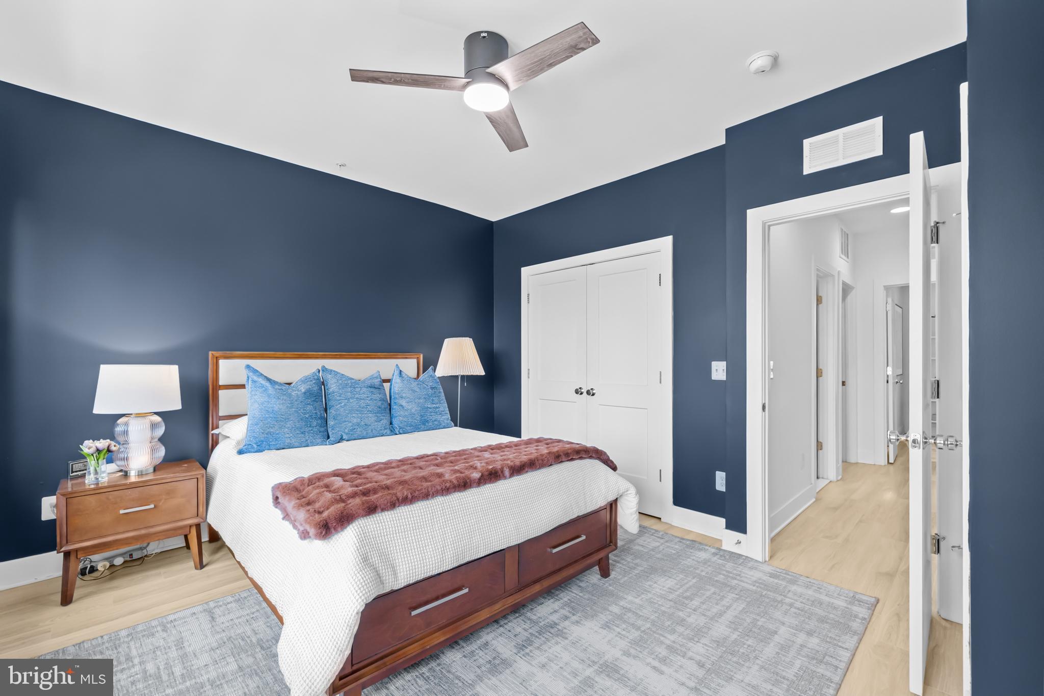 4509 12th Street Northeast Washington, DC 20017 - Photo 21 of 45 a bedroom with a bed and a chandelier