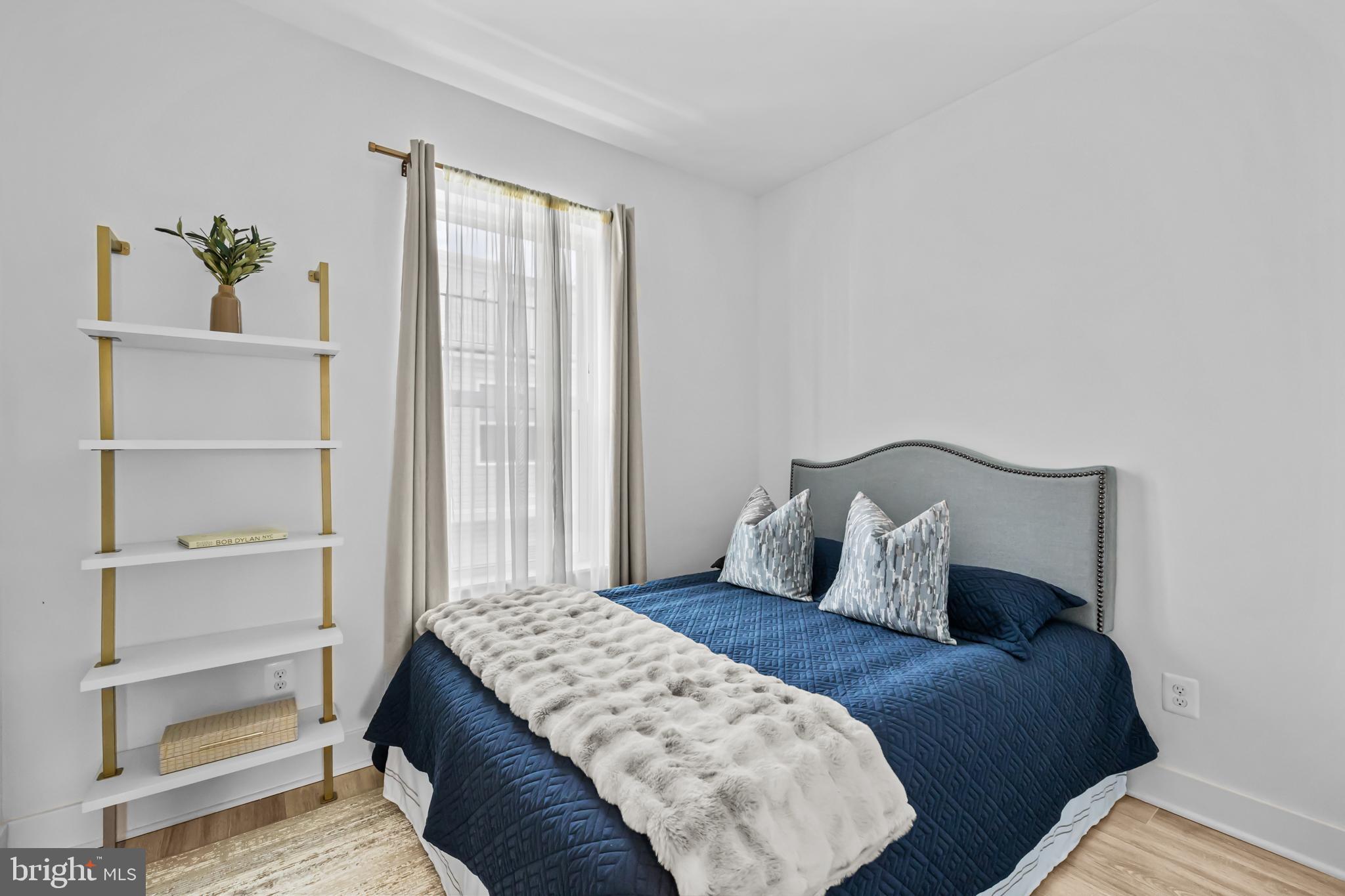 4509 12th Street Northeast Washington, DC 20017 - Photo 25 of 45 a bedroom with a bed and a window
