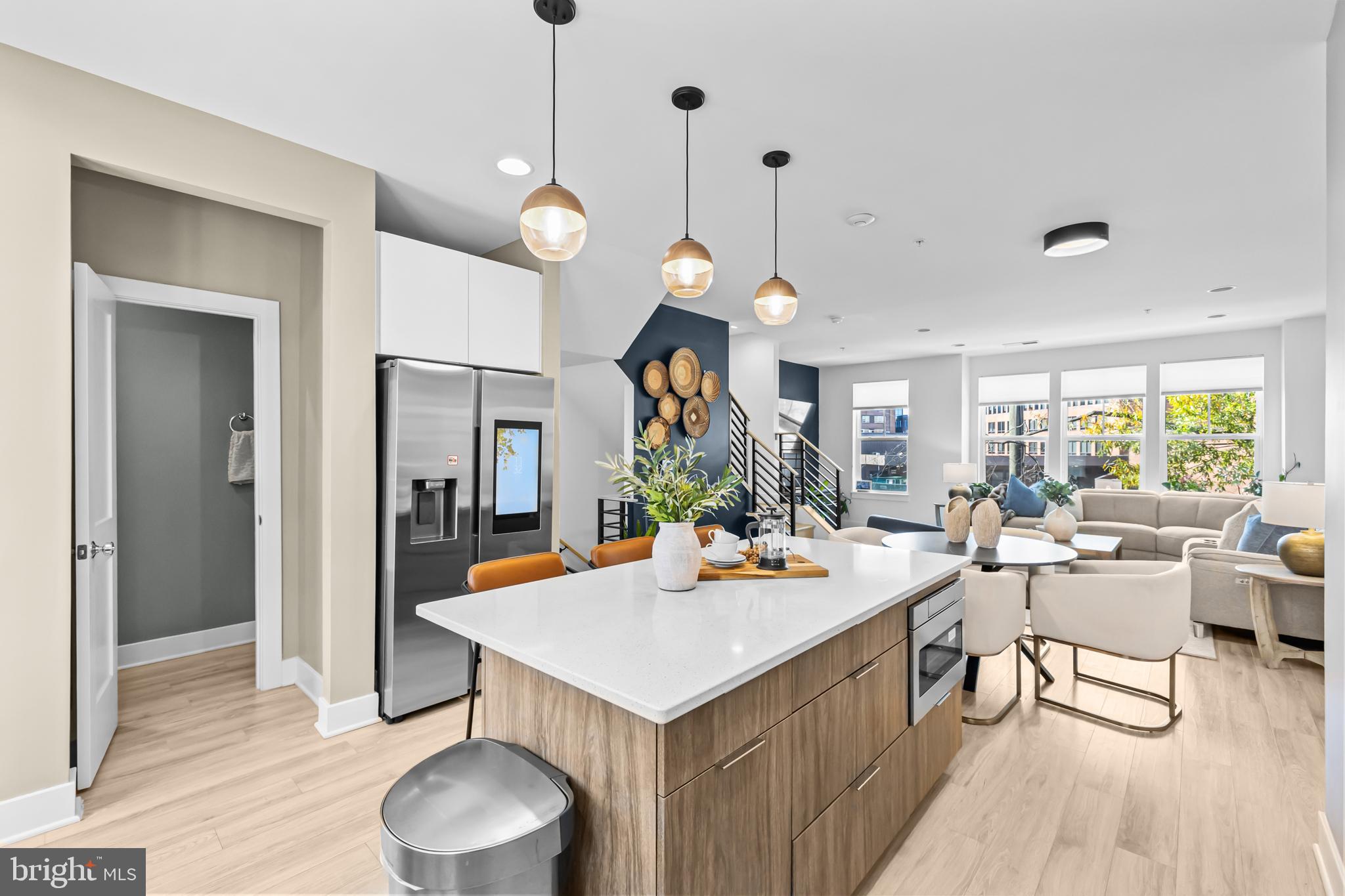 4509 12th Street Northeast Washington, DC 20017 - Photo 10 of 45 a kitchen that has a table chairs and a wooden floor