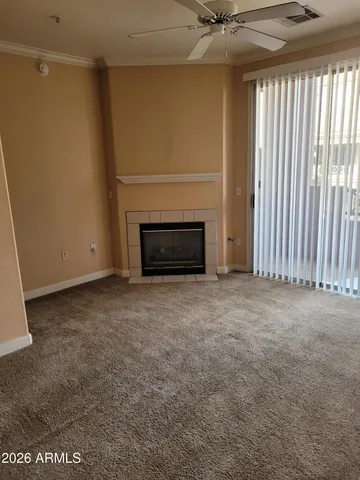 a view of empty room with fireplace