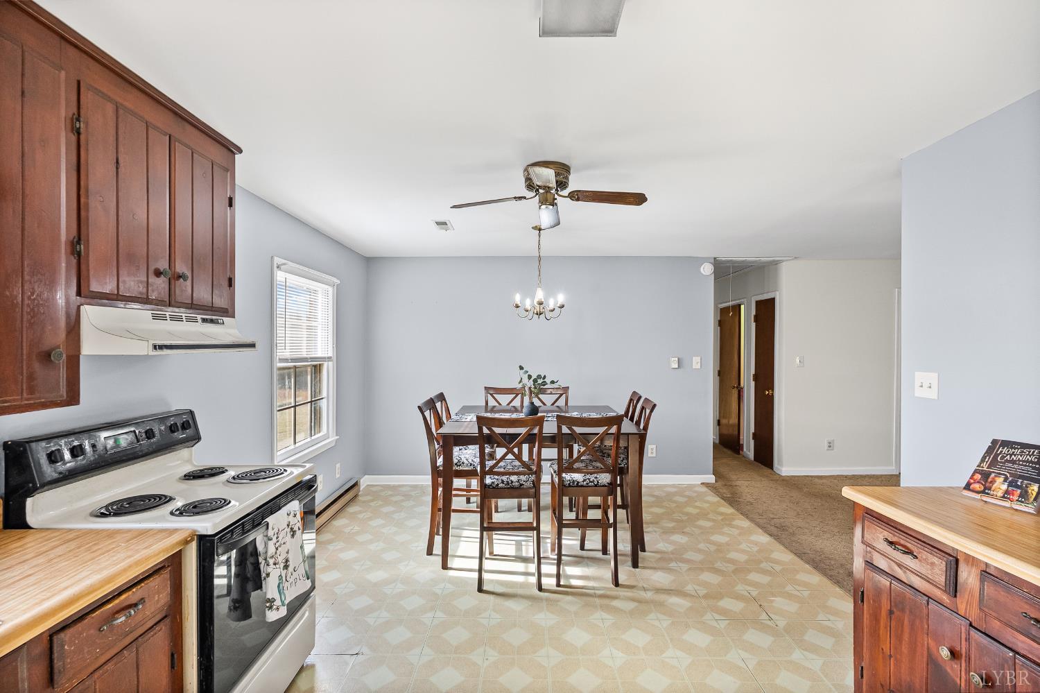 794 Little Dogwood Road Spout Spring, VA 24593 - Photo 11 of 54 a view of a dining room with furniture