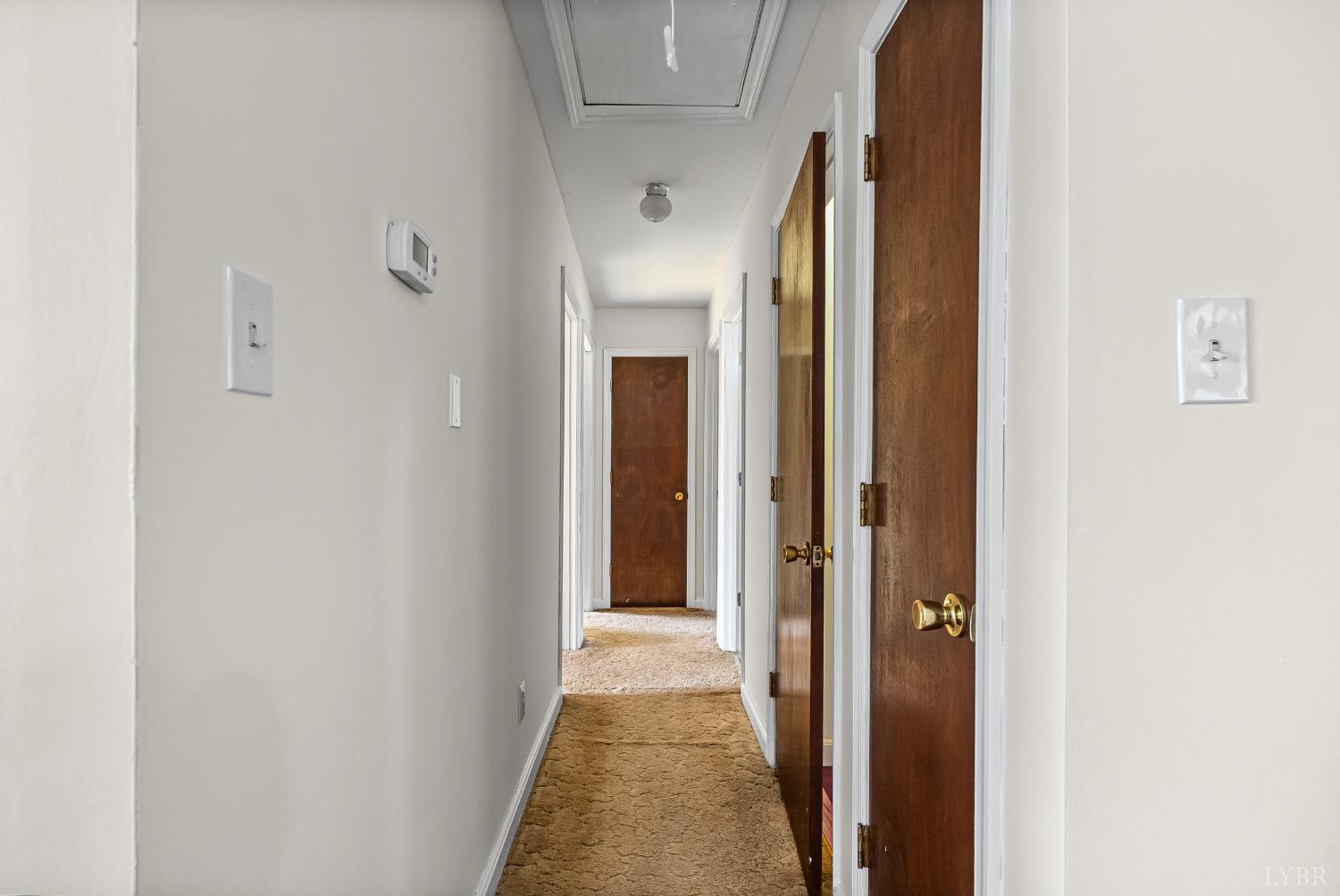 794 Little Dogwood Road Spout Spring, VA 24593 - Photo 15 of 54 a view of a hallway with wooden floor
