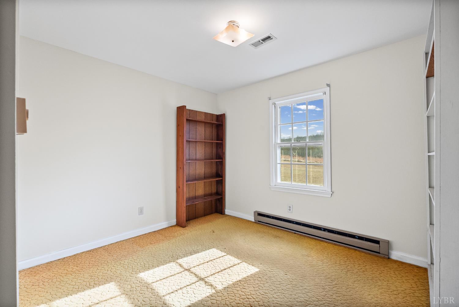 794 Little Dogwood Road Spout Spring, VA 24593 - Photo 19 of 54 an empty room with windows