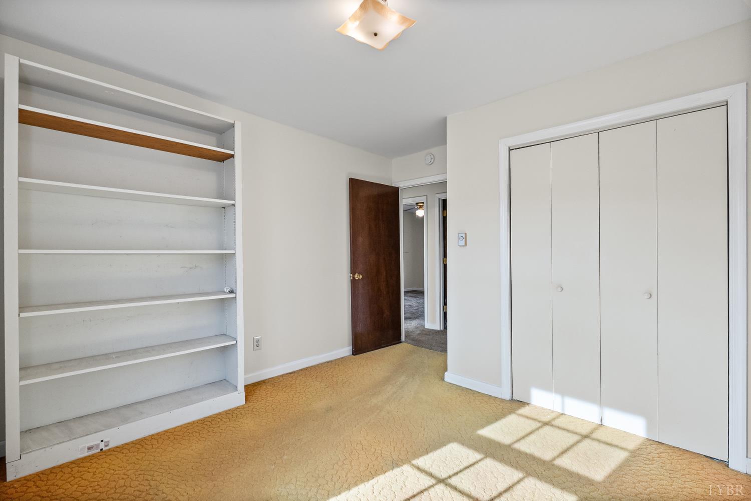 794 Little Dogwood Road Spout Spring, VA 24593 - Photo 20 of 54 a view of an empty room with a window