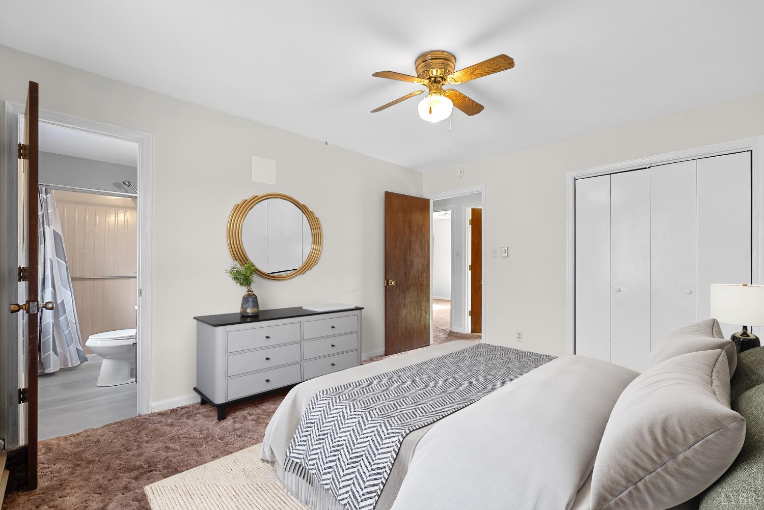 794 Little Dogwood Road Spout Spring, VA 24593 - Photo 21 of 54 a bedroom with a bed and a chandelier