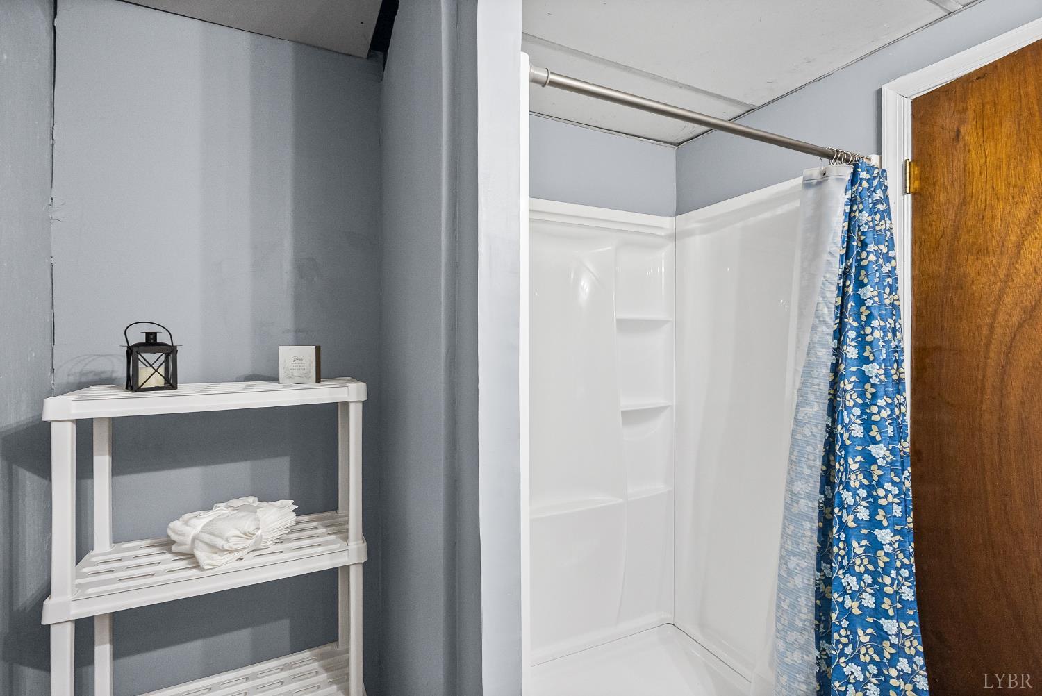 794 Little Dogwood Road Spout Spring, VA 24593 - Photo 28 of 54 a bathroom with a sink and a mirror