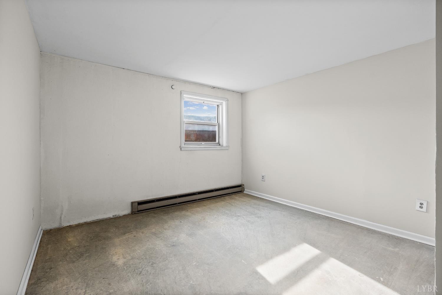 794 Little Dogwood Road Spout Spring, VA 24593 - Photo 32 of 54 an empty room with a workbench