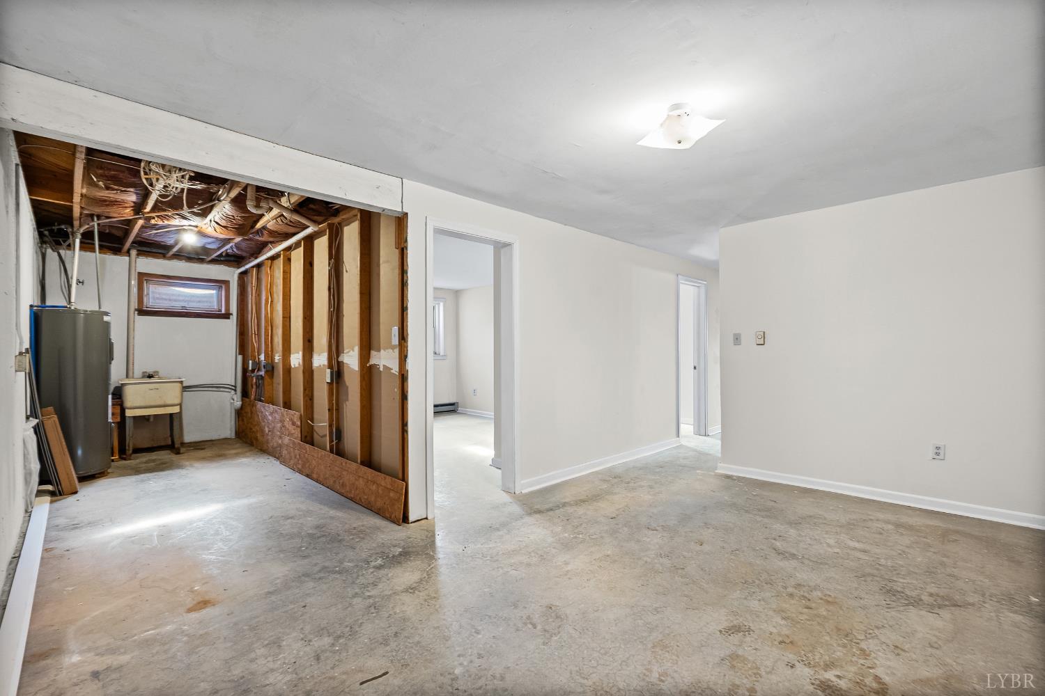794 Little Dogwood Road Spout Spring, VA 24593 - Photo 34 of 54 a view of a room with an entryway and brick walls