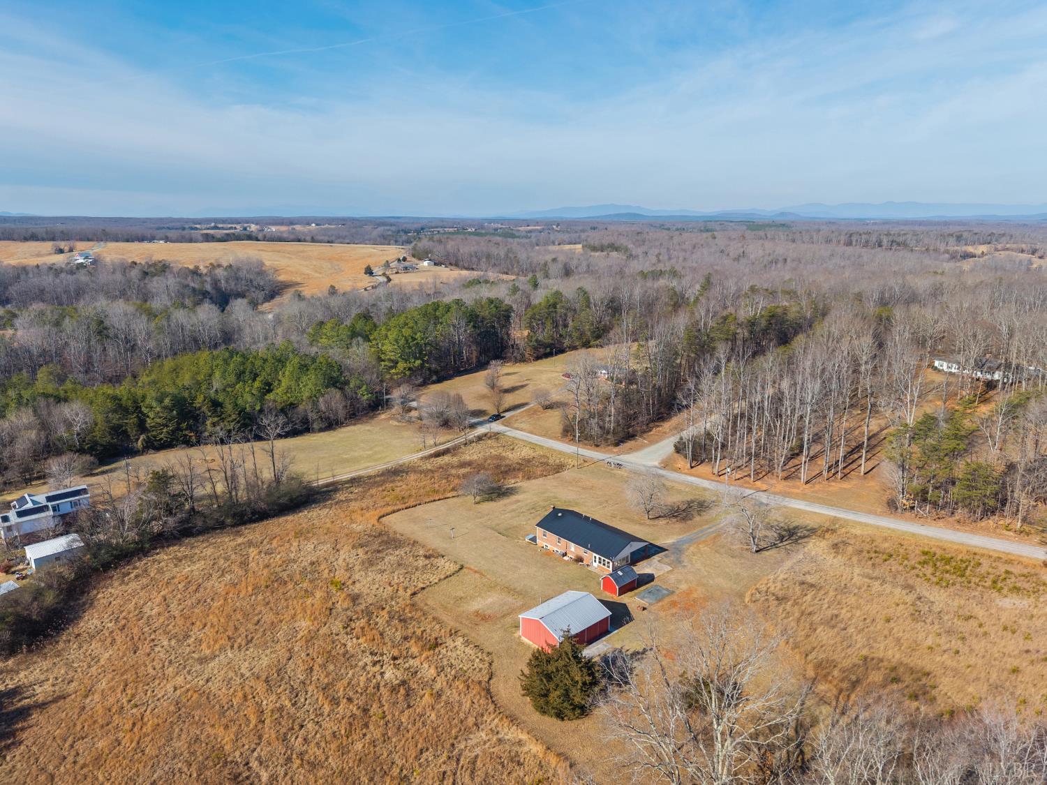 794 Little Dogwood Road Spout Spring, VA 24593 - Photo 52 of 54 an aerial view of a house with a yard