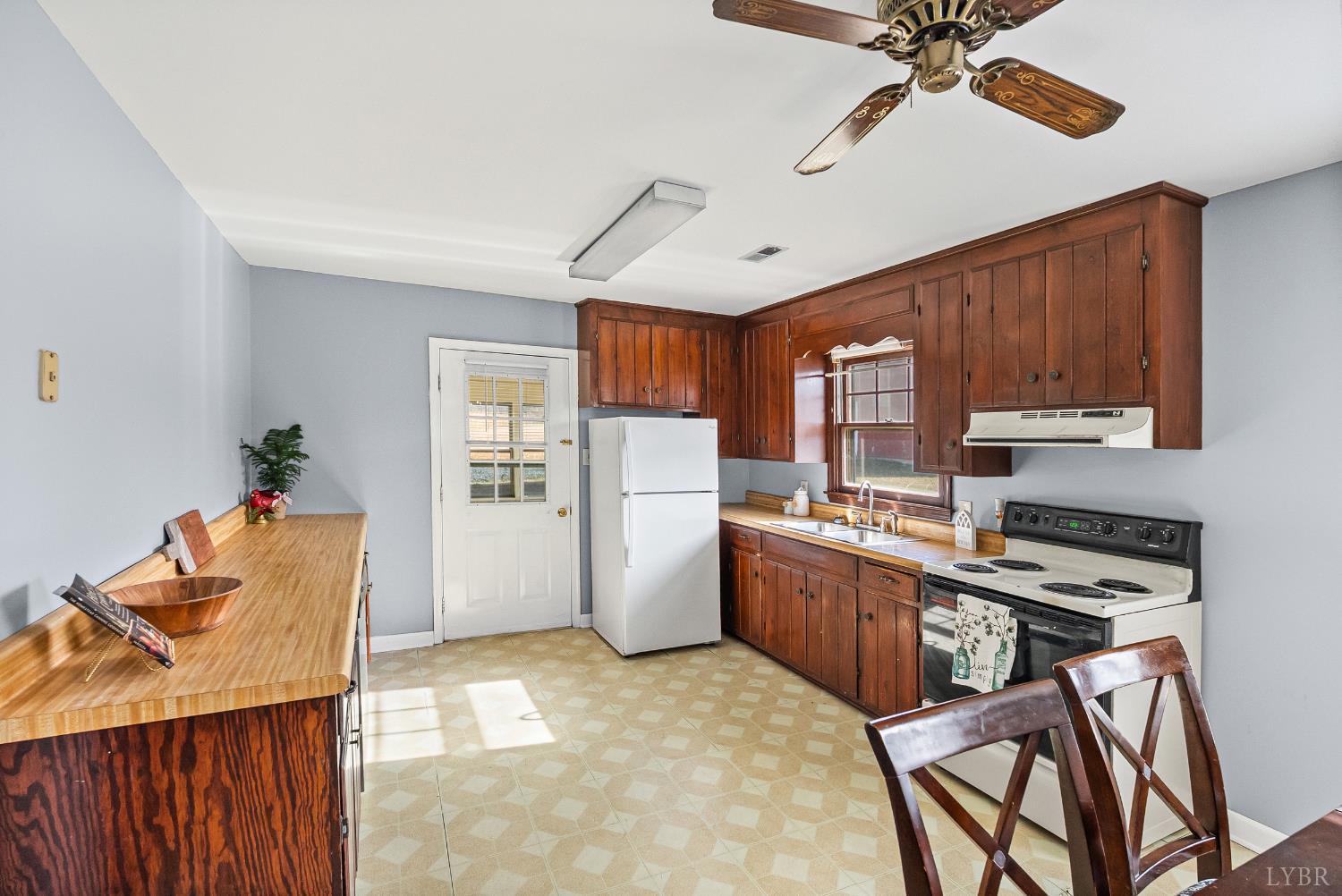 794 Little Dogwood Road Spout Spring, VA 24593 - Photo 8 of 54 a kitchen with stainless steel appliances granite countertop a stove top oven a refrigerator a sink and dishwasher with wooden floor
