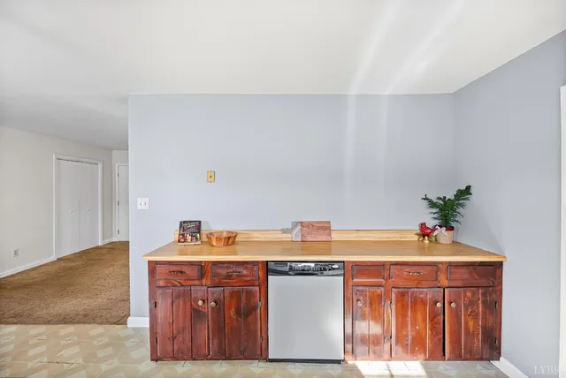 a room with a sink and cabinets