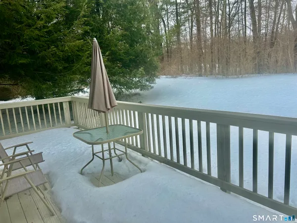 a view of a chairs and table in the patio