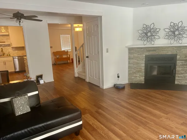 a view of a livingroom with furniture and a fireplace