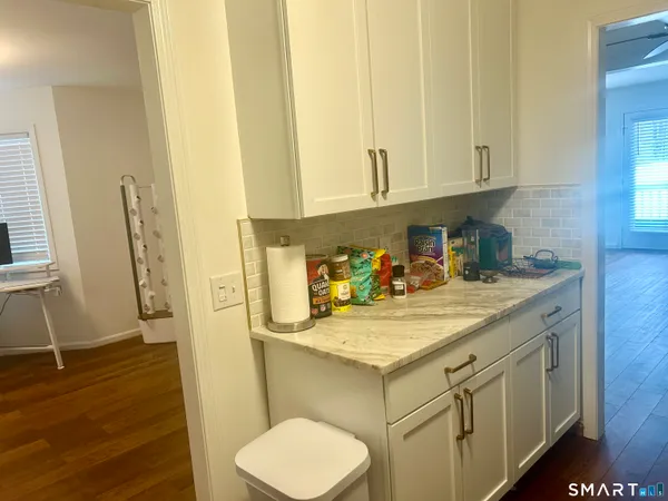 a bathroom with a sink a toilet and vanity
