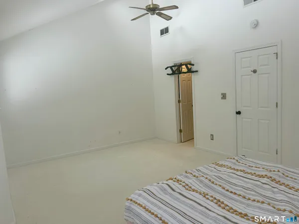 a view of a room with a ceiling fan