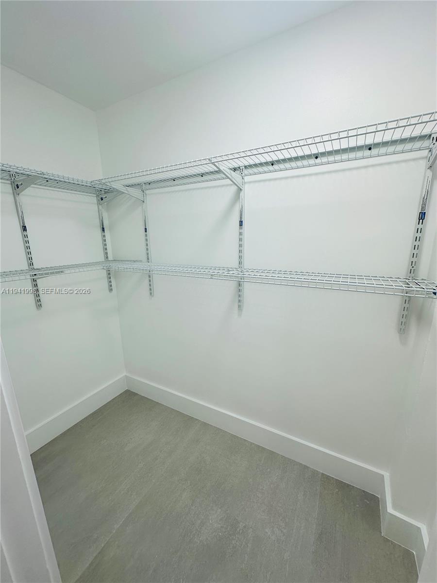 7157 West 19th Court, Unit 7157 Hialeah, FL 33014 - Photo 26 of 40 a view of a room with racks on the wall