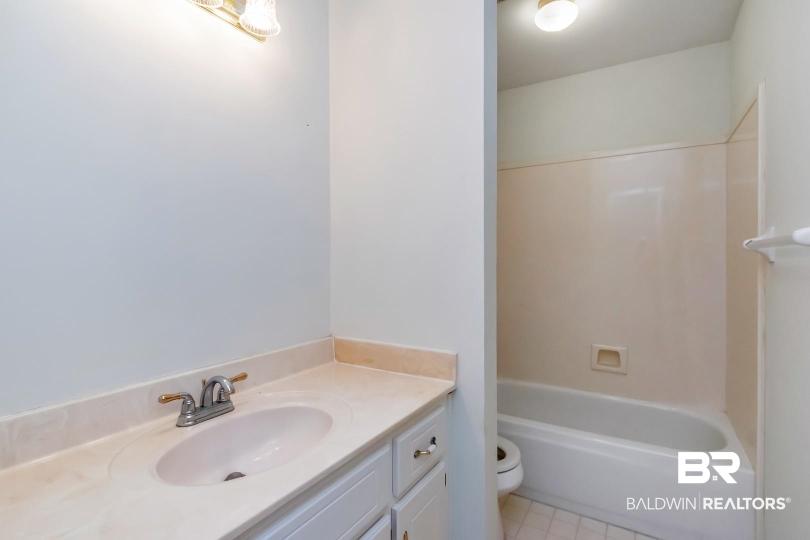 10006 Wedgefield Court Mobile, AL 36608 - Photo 31 of 34 Bathroom with toilet, tile patterned flooring, and vanity