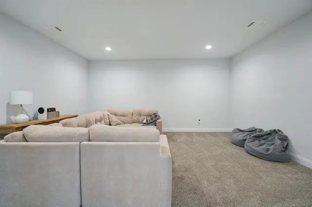 a room with a bed and a cabinets