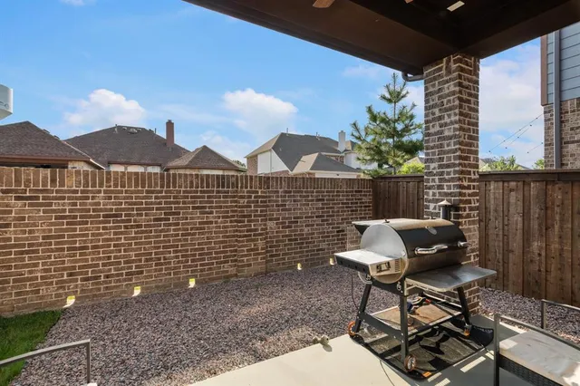 a view of a chairs and table in the patio