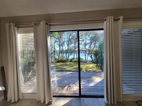 a spacious bathroom with a granite countertop sink a toilet and a mirror