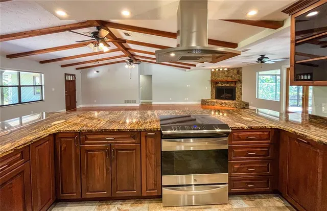 a kitchen with a stove and a sink