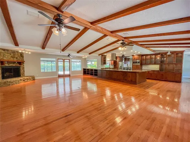 a view of a living room with kitchen