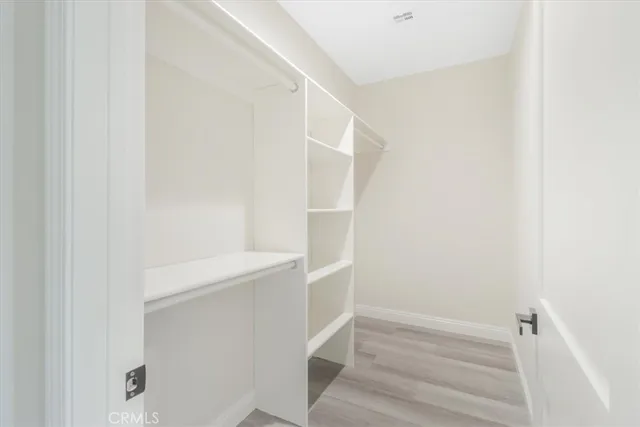 a view of an empty walk in closet