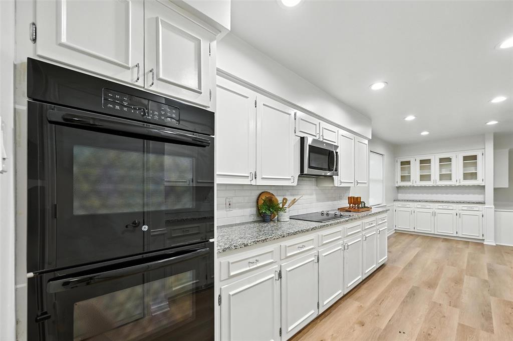 7407 Authon Drive Dallas, TX 75248 - Photo 11 of 31 a kitchen with a sink stove and microwave