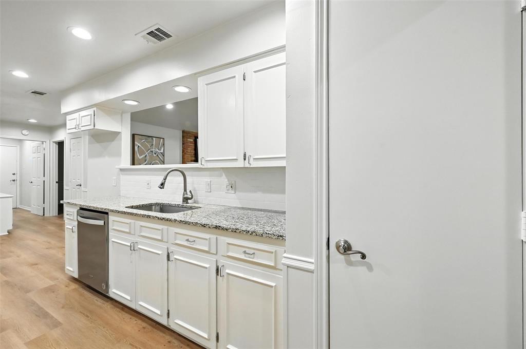 7407 Authon Drive Dallas, TX 75248 - Photo 12 of 31 a kitchen with a sink and cabinets