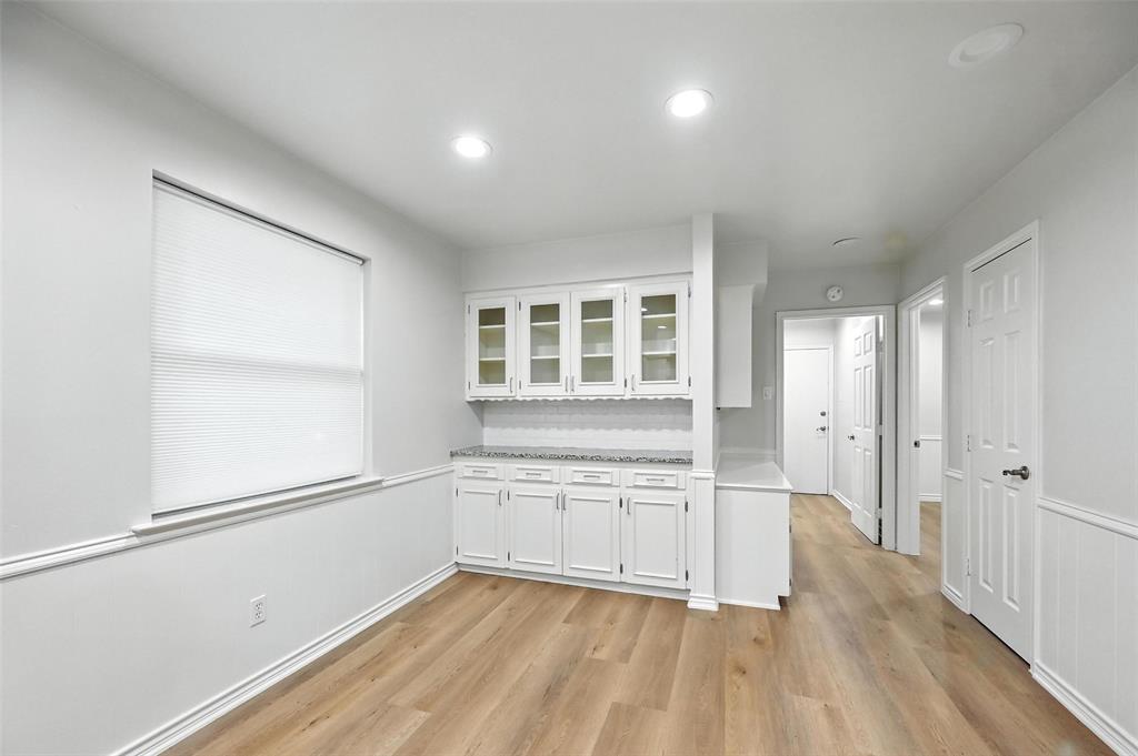 7407 Authon Drive Dallas, TX 75248 - Photo 13 of 31 wooden floor in an empty room with a window