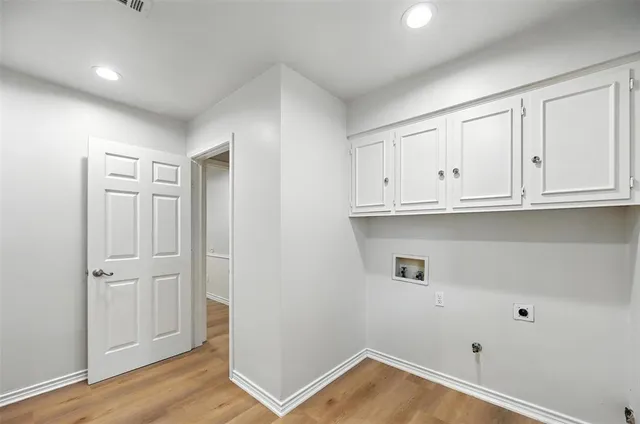 a view of cabinets and wooden floor