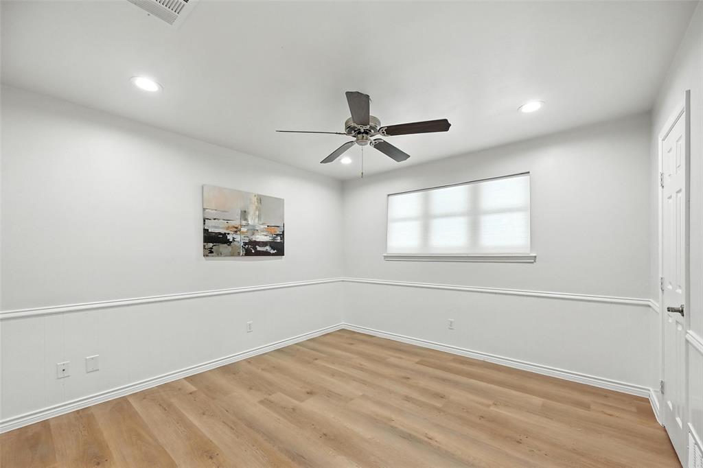 7407 Authon Drive Dallas, TX 75248 - Photo 20 of 31 a view of empty room with wooden floor and fan