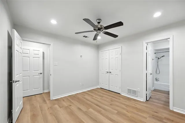 a view of an empty room and wooden floor