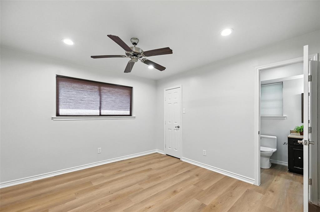7407 Authon Drive Dallas, TX 75248 - Photo 26 of 31 an empty room with wooden floor and a ceiling fan